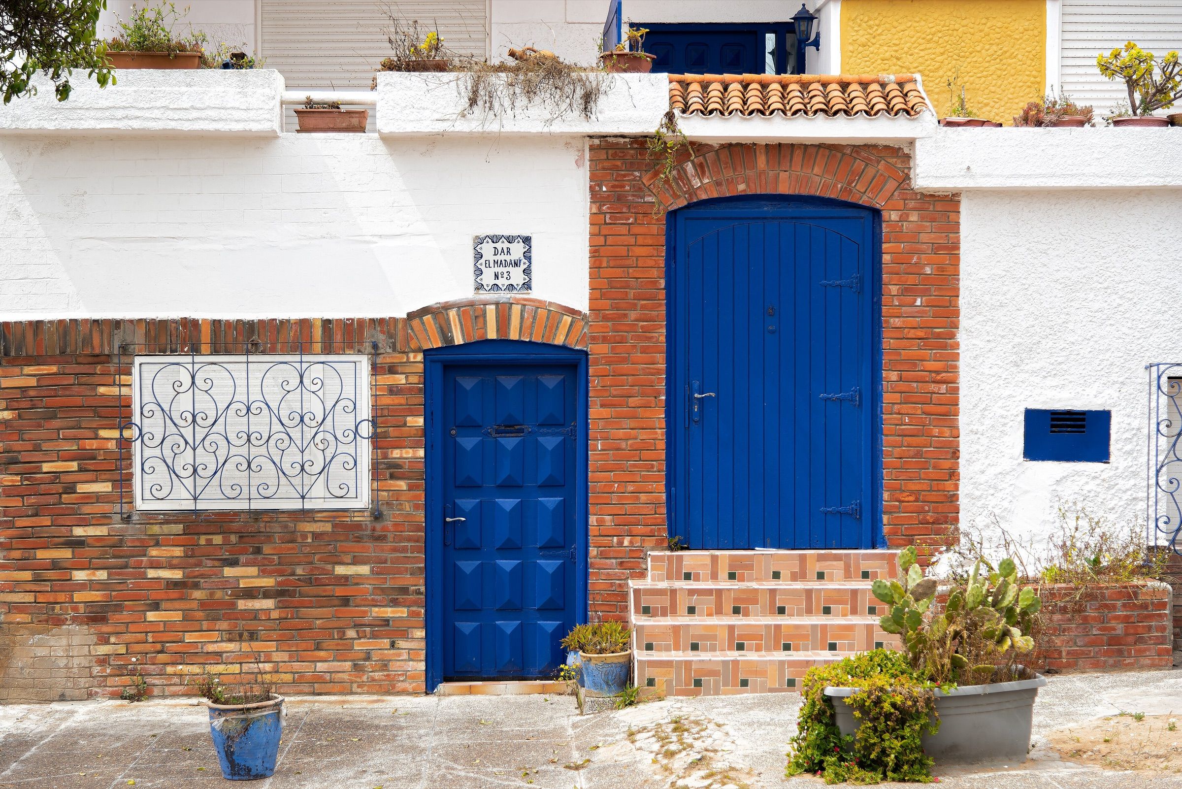 Blue doors in a street near Oualidia