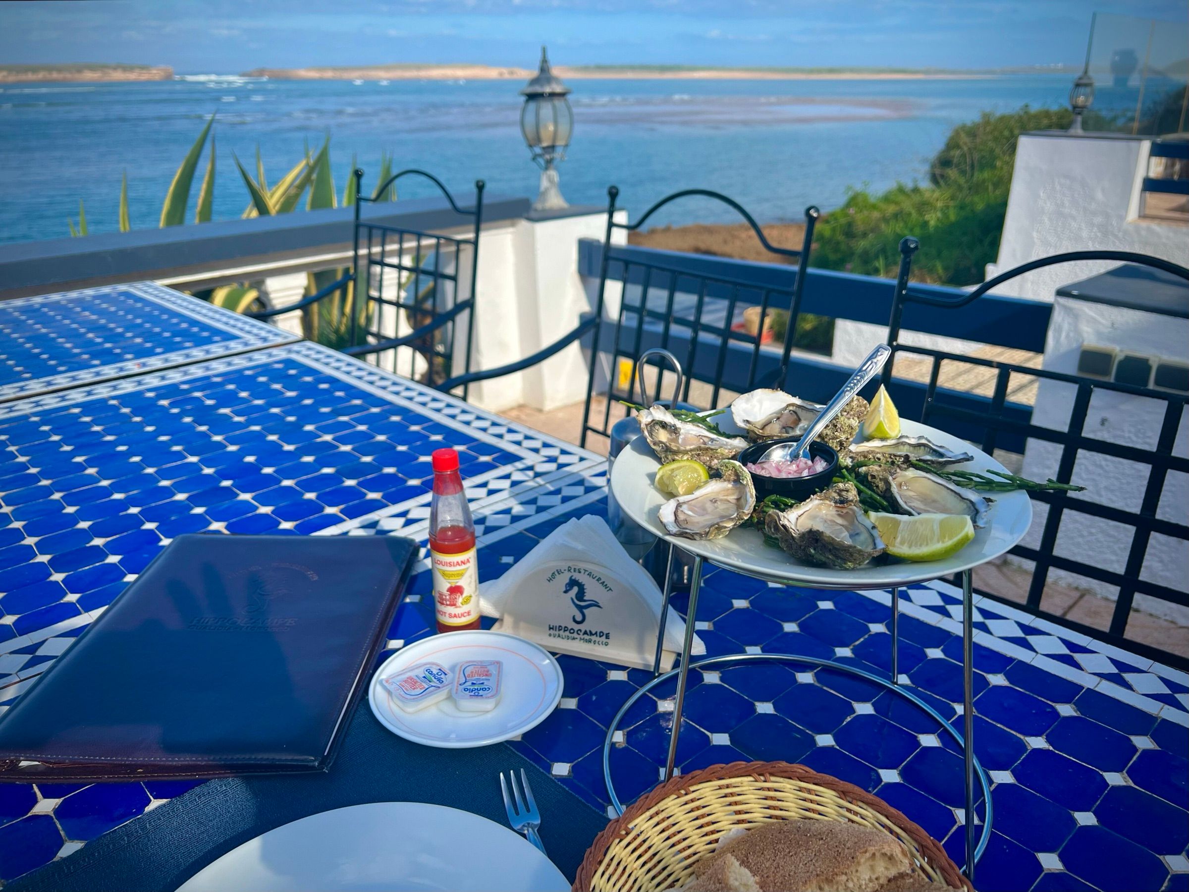 A meal on a terrace facing the lagoon
